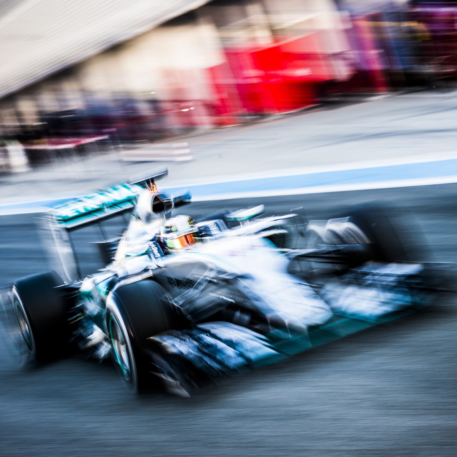 Formula 1 car racing down track with motion blur